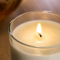 LOTSFÅGEL Scented candle in glass, Vanilla pale beige, 20 hr