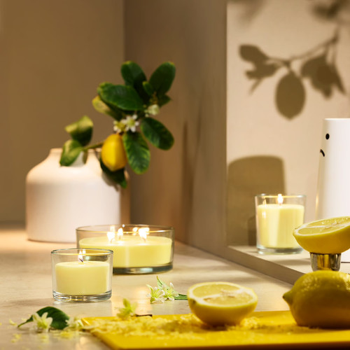 LOTSFÅGEL Scented candle in glass, Citrus flower light yellow, 40 hr