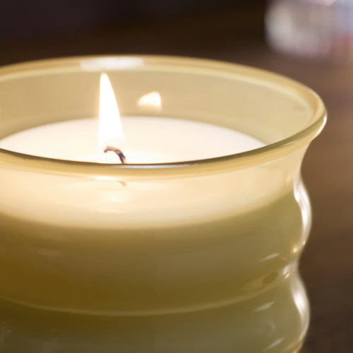 JUVELTRAST Scented candle in glass, Vanilla light yellow, 50 hr
