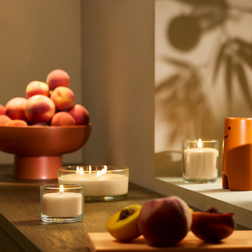 LOTSFÅGEL Scented candle in glass, Peach light orange, 40 hr